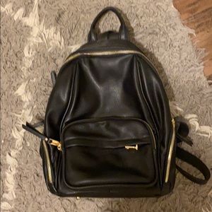 Just in Black vegan leather zip back pack pebbled